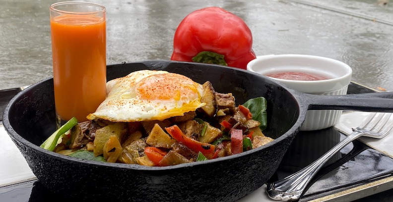 RED BELL BRISKET HASH with SPICY TOMATO JAM & FRIED FARM EGG Served with a SHOT OF VODKA CARROT JUICE