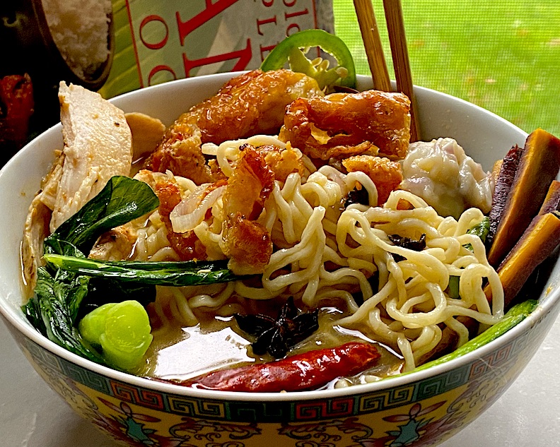 OVER THE TOP RAMEN in CHICKEN BONE BROTH with SPICY FRIED CHICKEN & PORK DUMPLINGS