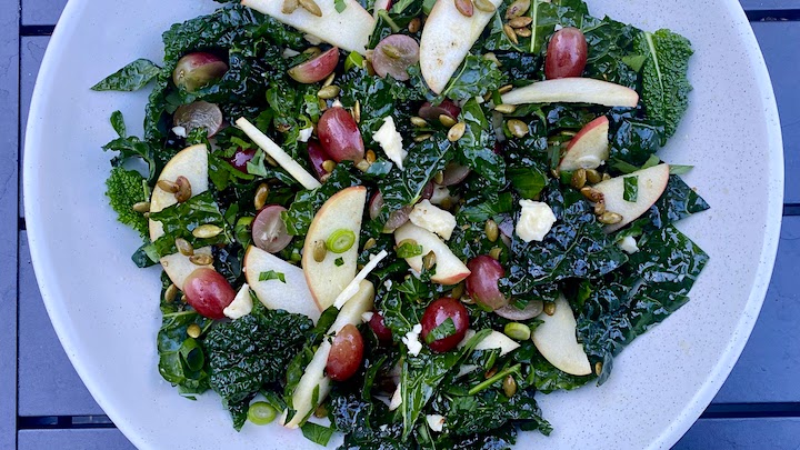 LACINATO KALE SALAD with APPLES, SHARP CHEDDAR, TOASTED PEPITAS & HONEY LEMON DRESSING